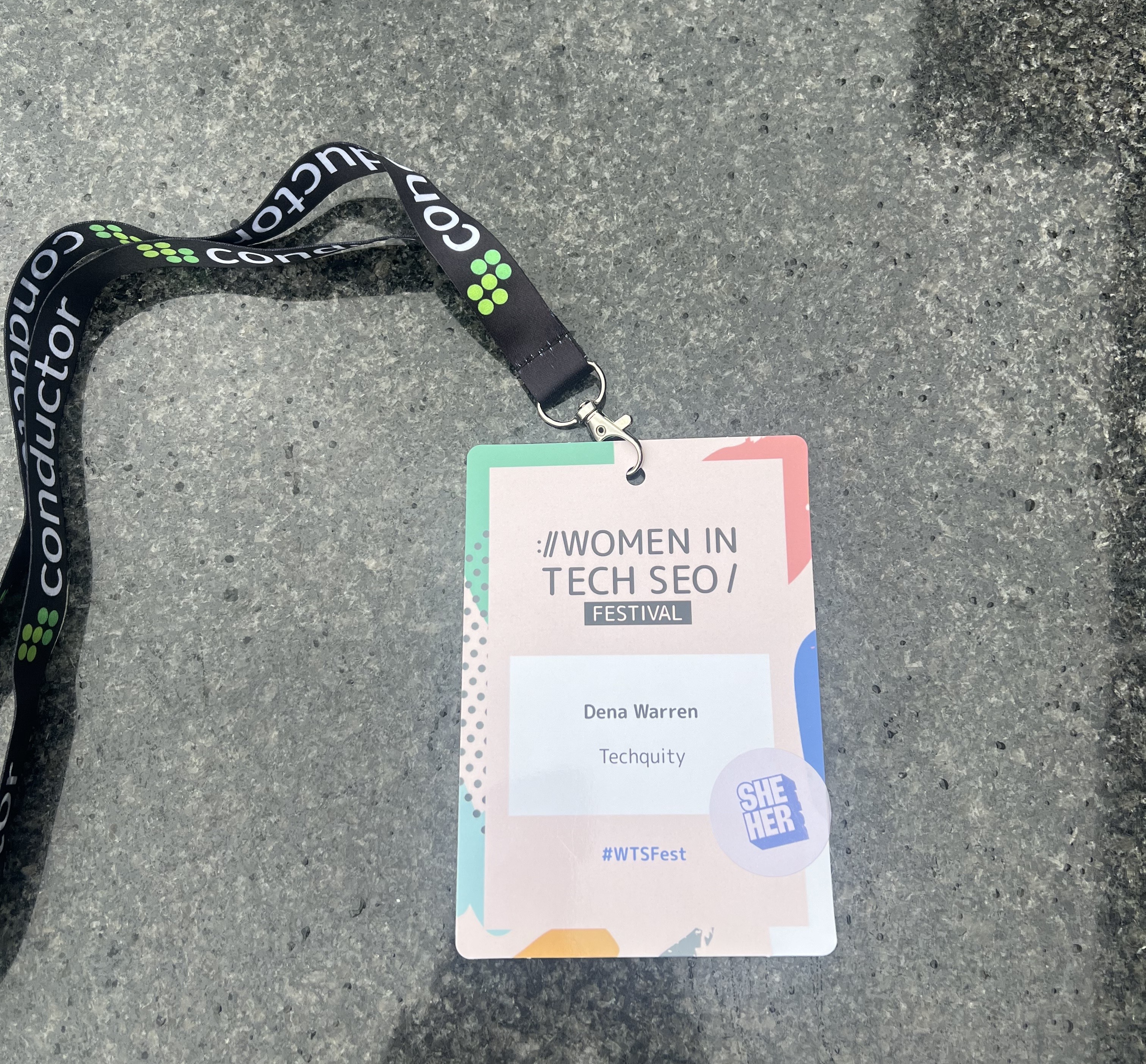 conference badge from Women in Tech SEO Festival with Dena Warren and Techquity printed on